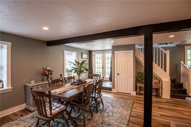 Large area currently being used as a dining room,