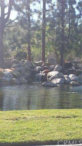 Tranquil koi pond, next to HOA pool; a few steps a