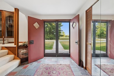 Entrance foyer with stone tile floors