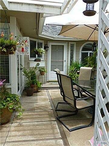 Gated entry to Carport or Front partially covered 