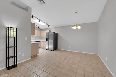 Kitchen featuring stainless steel appliances, ligh