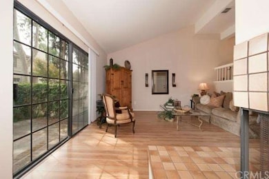 LIVING ROOM with laminate wood floor, high vault c