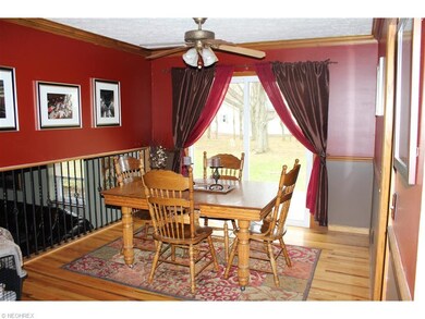 The dining room also has wood floors. There is acc