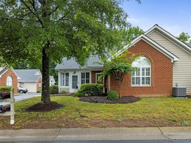 Paved driveway leads to 2 car garage.