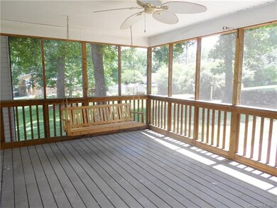 Large screened porch with ceiling fan right off the kitchen.  There is a patio down the steps with a fire pit and seating.