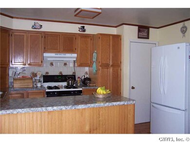 Kitchen. Door on the left of picture leads to full