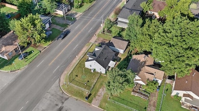 Aerial overview of property's location with nearby suburban area