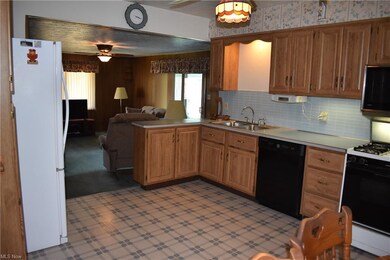 Well cared for kitchen opens to family room so it'