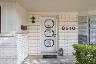 A front porch with a classic vibe provides a welcoming entry point to the home. It's a perfect spot for relaxing with a cup of coffee or chatting with neighbors.