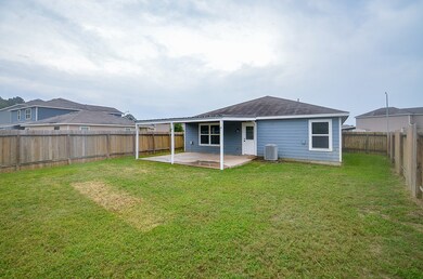 Rear of home with covered porch