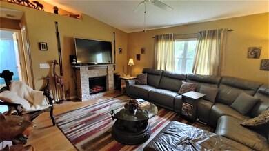 Vaulted ceiling and fans in living area