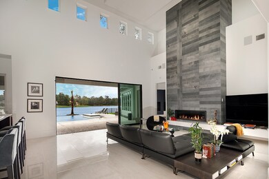 This living area features a dramatic floor to ceil