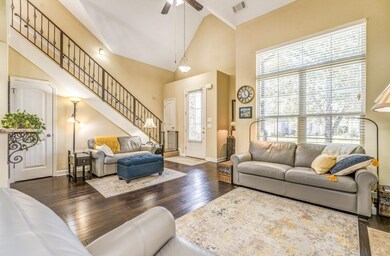 Living room with ceiling fan, dark hardwood / wood
