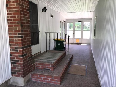 Carpeted Breezeway Connects Home to Heated 4-Car G