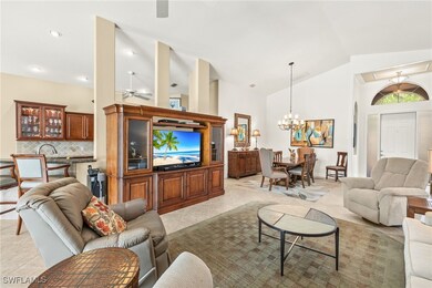 Living room with light tile patterned floors, high