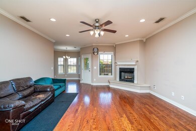 Unfurnished living room featuring ceiling fan with