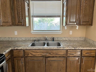 Kitchen with a sink and range