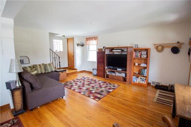 Living Room with closet by stairs.
