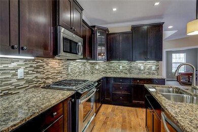 Backspash, and glass front corner cabinet are just