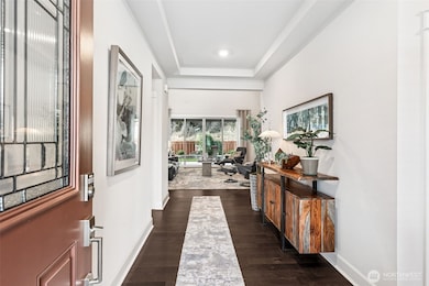 Step inside to a grand and open entryway.  With a view to the back yard.