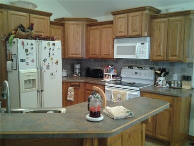 Custom Oak Cabinets in the Kitchen with a Breakfas
