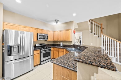 Kitchen with appliances with stainless steel finis