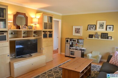 Another view of the living room and doorway to hal