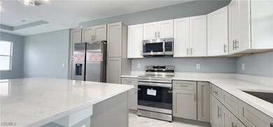 Kitchen featuring appliances with stainless steel