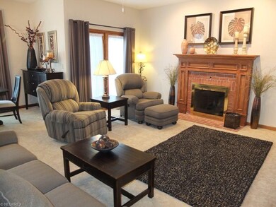 Open living room with fireplace.