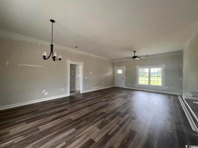 Empty room with dark hardwood / wood-style floors 