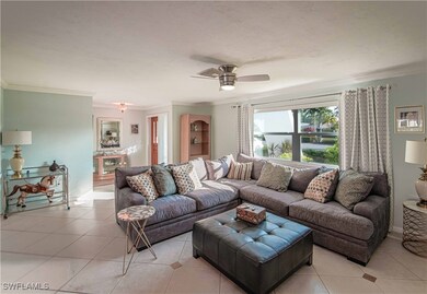 Living area with light tile patterned floors, orna