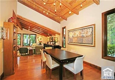 Formal dining with yard views and backyard access.