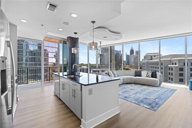 Kitchen featuring a sink, healthy amount of natural light, floor to ceiling windows, light wood finished floors, and recessed lighting