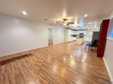 Unfurnished living room featuring recessed lighting, light wood-style flooring, and a ceiling fan