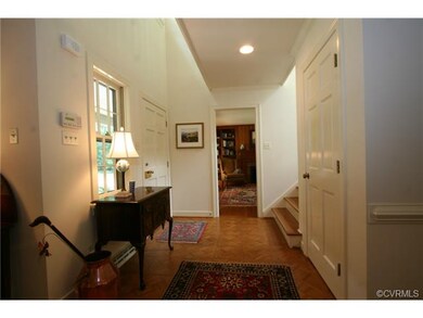 Two story  entrance hall with staircase leading to