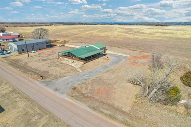 Birds eye view of property with a rural view
