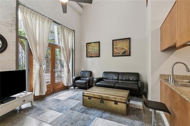This darling unit is light-filled with a comfortable living room with DOUBLE DOORS that open directly on the COURTYARD. Enjoy it almost as a second living room!