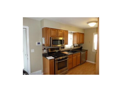 Updated oak cabinets, ceramic back splash, stainless steel LG kitchen appliance package, Kohler large sink bowl, laminated wood flooring, new light fixtures, GFCI compliant