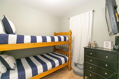 Bedroom with wood finished floors