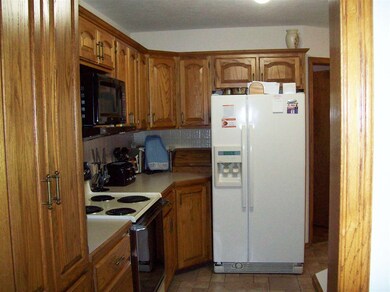 Kitchen with refrigerator that stays