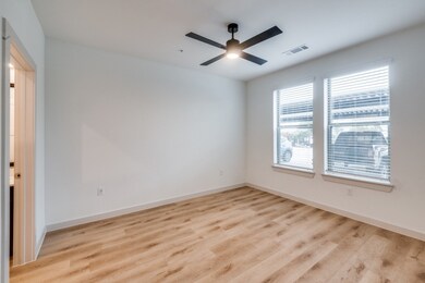 Spare room with light wood-style floors and ceiling fan
