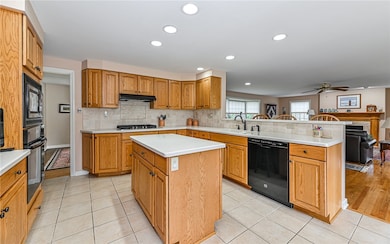 Corian countertops, ceramic tile backsplash, gas c