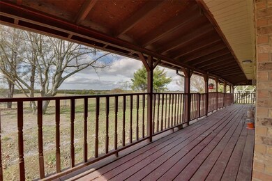 The long covered patio enjoys relaxing acreage views.  Lake Lavon is just minutes away!