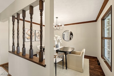 Dining space featuring ornamental molding and a chandelier