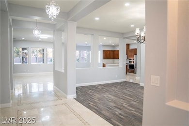 Foyer featuring a chandelier, recessed lighting, a