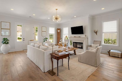 Additional living room view. Plenty of natural light floods the space through gorgeous windows.