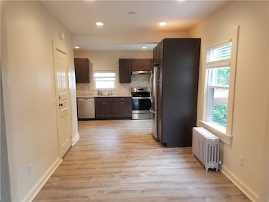 Front Door Entry Looking at Kitchen