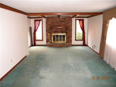 Living Room. The living room. Note wood burning fp
