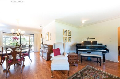 The spacious living room flows into formal dining