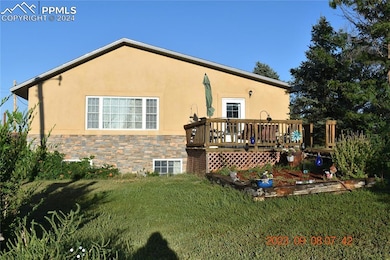 Eastside of the house with a small intimate deck a